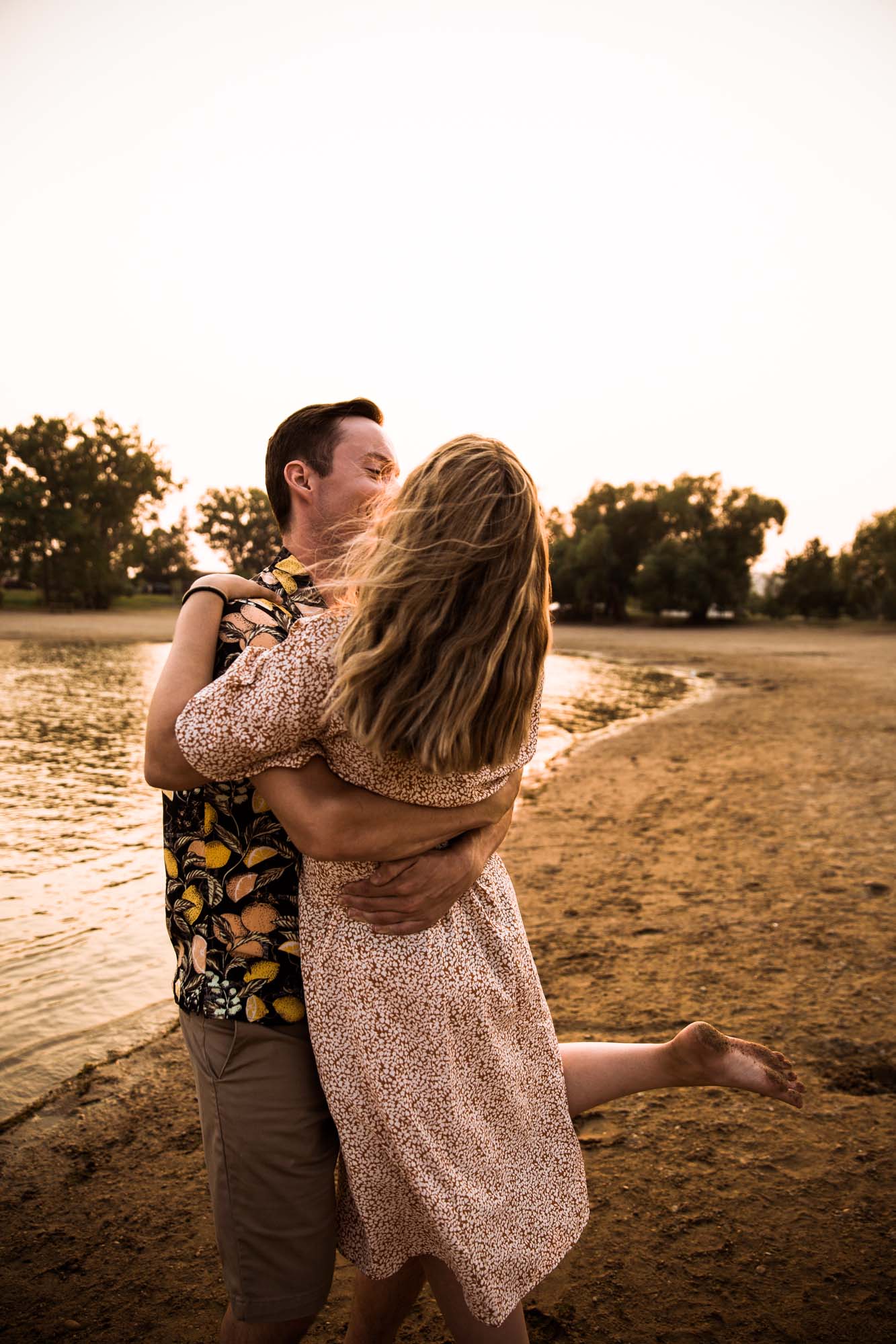 Calgary wedding photographer, engagement session on the beach, couple at sunset at Little Bow Provincial Park