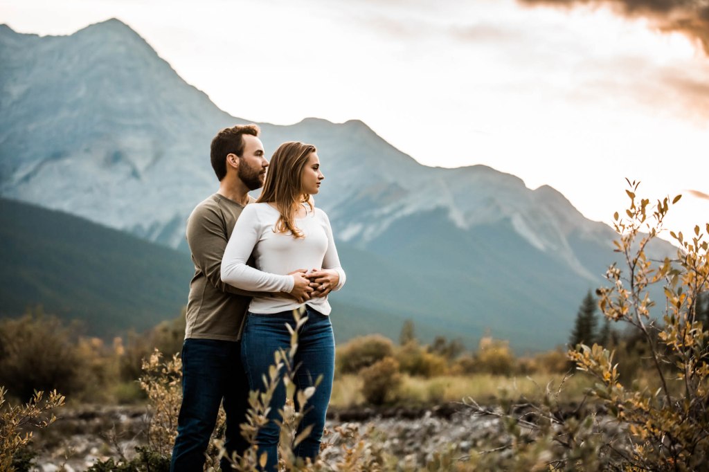 Calgary wedding and engagement photographer, couple in the mountains for adventure engement photos in Kananaskis Country