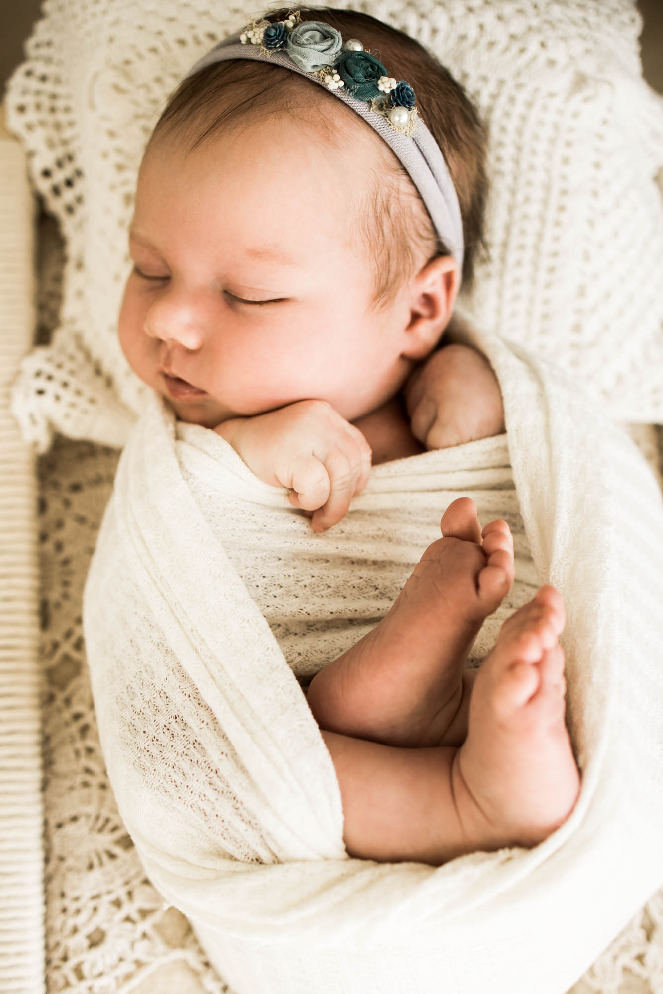 Calgary newborn and maternity photographer, in-home lifestyle photos with a family holding their newborn baby