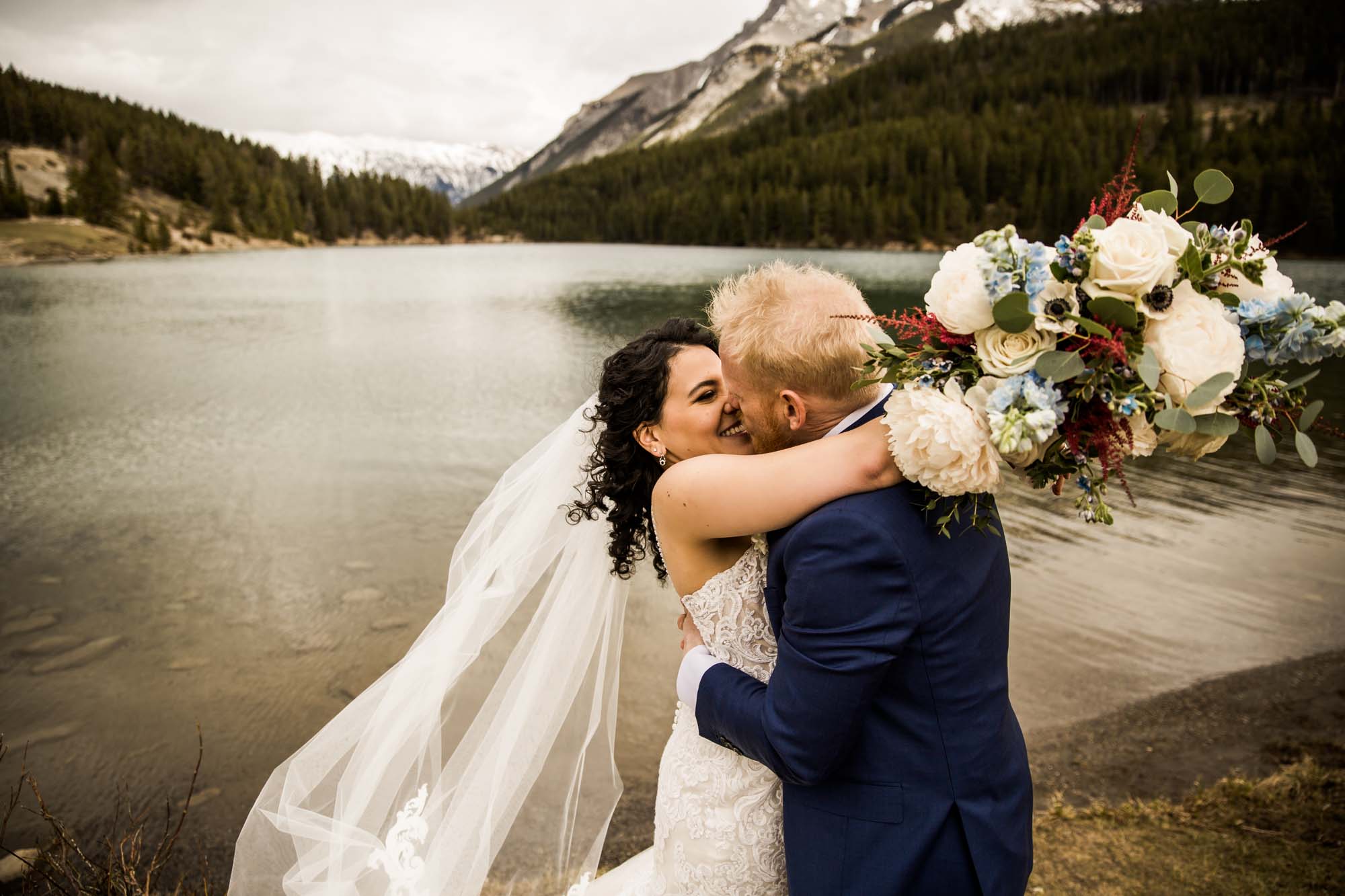 Banff wedding photographer, a couple on their wedding day at the Rimrock, St Mary's Parish in Banff National Park