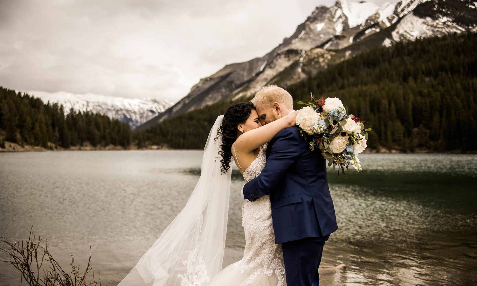 Banff wedding photographer, a couple on their wedding day at the Rimrock, St Mary's Parish in Banff National Park