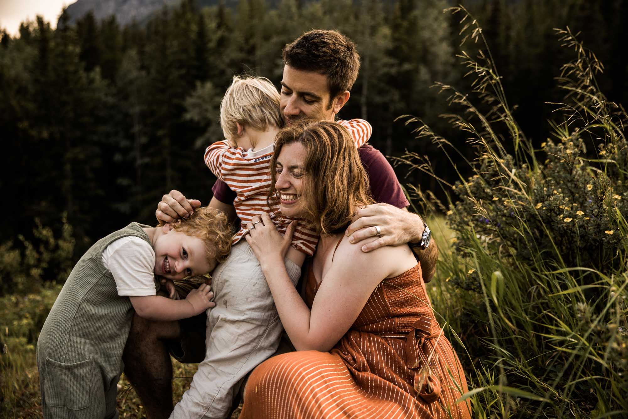Calgary, Kananaskis, Banff lifestyle family photographer, family in the mountains in Kananaskis Country in a field with wild flowers at sunset