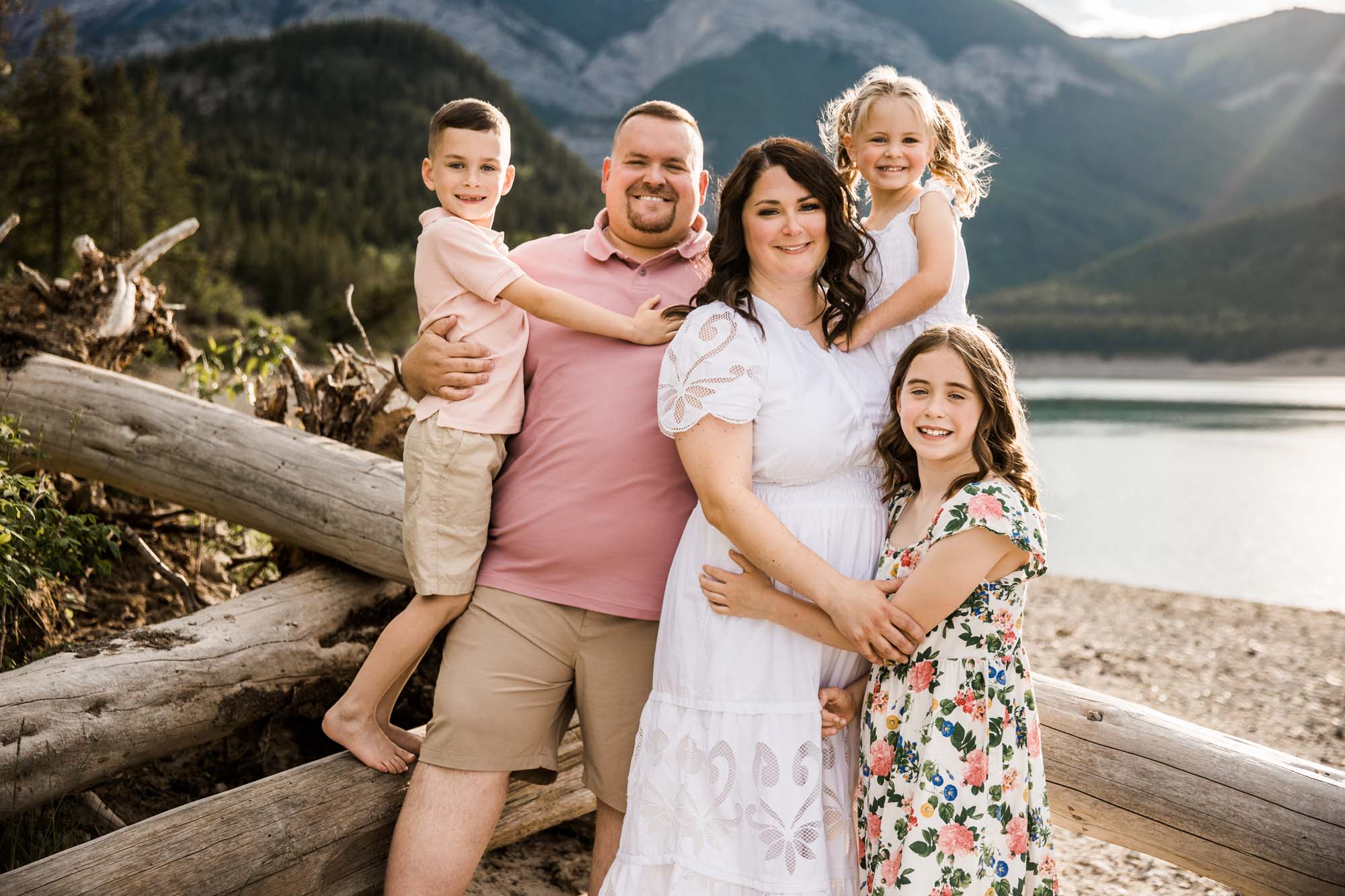 Calgary, Banff, Kananaskis Country lifestyle family photographer, family posing during their beach photoshoot in the mountains in Kananaskis