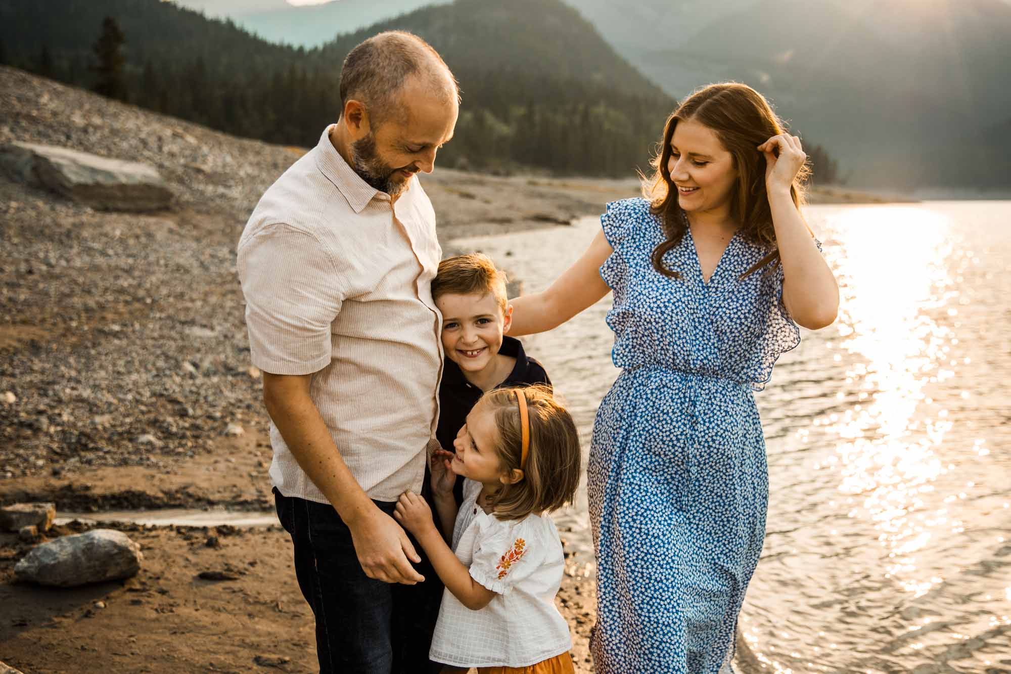 Calgary, Banff, Kananaskis Country lifestyle family photographer, natural and candid photos of a family in front of the mountains at Barrier Lake